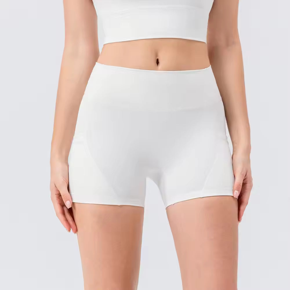Person wearing white high-waisted shorts on a light gray background